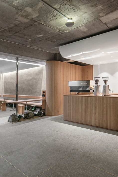 Sleek design is paired with traditional Korean elements at Cafe Oriente in Seoul’s creative Itaewon neighbourhood. Designed by local practice, Labotory, the cafe is partially submerged into the ground and features a combination of raw concrete, untreated wood, gravel, rock and a touch of greenery.

Photography: Yongjoon Choi

#southkorea #seoul #cafe #minimalistdesign #minimalism #design #travel #concrete #interior #interiors #interiorstyle Concrete Cafe Interior Design, Concrete Cafe Interior, Concrete Restaurant Design, Cafe Wood Interior, Minimal Cafe Design Interiors, Korean Cafe Design, Wood Cafe Design, Wood Cafe Interior, Minimal Restaurant Design