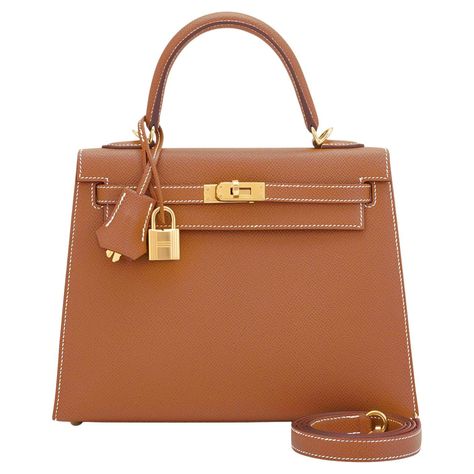 Hermes Gold Kelly 25cm Tan Sellier Shoulder Bag Z Stamp, 2021 The most wanted bag and the only one you need this spring summer! Just purchased from Hermes store; bag bears new 2021 interior Z Stamp Brand New in Box. Store Fresh. Pristine Condition (with plastic on hardware). Perfect gift! Comes full set with keys, lock, clochette, shoulder strap, sleeper, rain protector, and Hermes box. If you buy only one Kelly, this Gold 25cm Kelly is the only one you need! Gold is the perfect, iconic statemen Sac Hermes Kelly, Tas Hermes, Hermes Kelly 25, Kelly Brown, Hermes Kelly Bag, Tan Bag, Only One You, Box Store, Gold Bag
