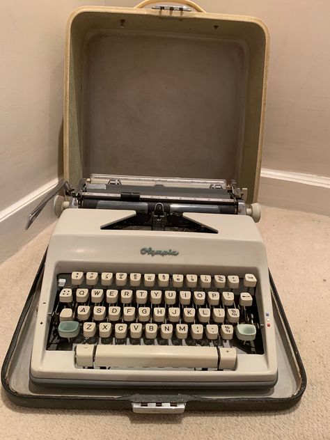 Olympia  typewriter in hard case with clip in fixings for stability. Considered by many to be one of the finest typewriters. Good condition with usual signs of vintage item, possible repair to small plastic area by roller as shown? Spare ribbon spool. Olympia, Olympia Typewriter, Typewriter, Hard Case, Clip Ins, Vintage Items, Conditioner, Repair, Ribbon