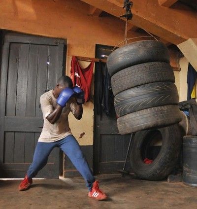 I recently shared the picture above on Facebook (courtesy of Damiano Rosso). The photo shows a boxer training with a homemade punching bag at the Kampala Boxing Club in Uganda. Since posting the photo, I’ve had several people ask about how to create one of these bags. Last year, I posted a tutorial that details … Homemade Punching Bag, Diy Tire, Diy Gym Equipment, Punch Bag, Diy Gym, Diy Workout, Boxing Gym, Outdoor Gym, Punching Bag