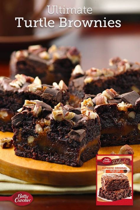 Make the ultimate indulgent brownie with brownie mix and a few other simple ingredients (gooey caramel and pecans)! Expert tip: You can make these bars the day ahead and store tightly covered at room temperature. Ultimate Turtle Brownies, Turtle Brownies With Box Mix Recipe, Deluxe Brownies, Turtle Brownie, Homemade Ganache, Brownie Recipe Video, Caramel Pecan Cheesecake, Turtle Brownies, Cookie Dough Cake