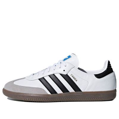 The adidas Samba OG is a classic sneaker that's been remastered for a new generation. It features a full-grain leather upper, suede toe, and contrast heel panel. It also has bluebird and foil logos to authenticate the retro feel. The gum rubber outsole provides multi-directional tread pattern and excellent grip. (SNKR/Skate/Light/Unisex/Low Top) Sambas White, Adidas Samba White, Adidas Sambas, Adidas Samba Og, Samba Og, Street Fashion Men Streetwear, Men Streetwear, Black Gums, Adidas Samba