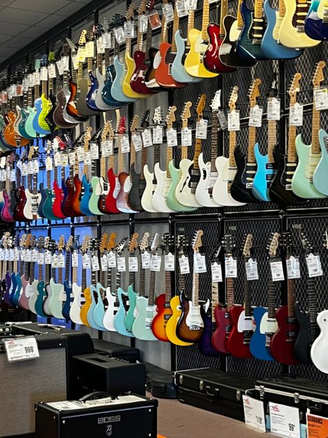 bunch of electric guitars at guitar store Guitar Store Aesthetic, Electro Guitar Aesthetic, Iphone Wallpaper Rock, Electronic Guitar, Guitar Aesthetic, Rockstar Aesthetic, Guitar Store, Guitar Obsession, House Md