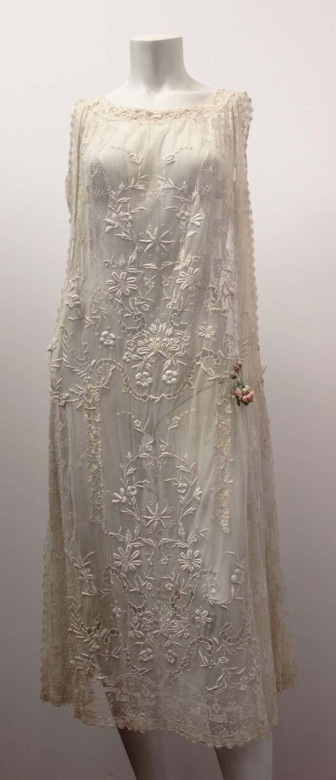 For Sale on 1stDibs - 1920's floral lace wedding dress. Mesh side panels. Satin drop-waisted sash*. Pink satin ribbon rose detail on side. *not shown in photo silver-toned rhinestone Vintage Wedding Dresses, Vintage Wedding Dresses 1920s, Wedding Dress Mesh, 20s Wedding Dress, Embroidered Lace Wedding Dress, 1920s Wedding Dress, Floral Lace Wedding Dress, 20s Dresses, Wedding Dresses Ideas