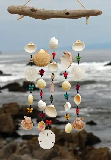 35 DIY Wind Chime Ideas - Nerd In The House Homemade Wind Chimes, Seashell Mobile, Seashell Wind Chimes, Wind Chimes Homemade, Shell Wind Chimes, Diy Suncatchers, Wind Chimes Craft, Seashell Projects, Diy Wind Chimes