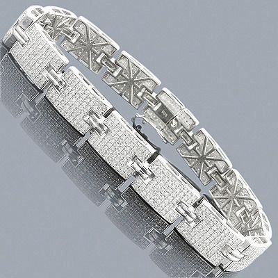 Sterling Silver Bracelets: This Mens Diamond Bracelet in sterling silver weighs approximately 41 grams and showcases 3.97 ctw of pave-set round diamonds. Featuring a versatile design, this is a great budget piece featuring polished sterling silver and genuine diamonds. This men's diamond bracelet is also available in 10K and 14K gold, please contact us for details. Mens Link Bracelet, Mens Diamond Bracelet, Mens Diamond Jewelry, Bracelets Design, Mens Bracelet Silver, Bracelet Argent, Schmuck Design, Diamond Bracelets, Silver Diamonds