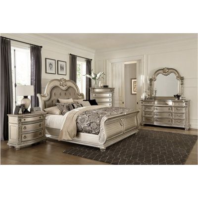 Silver Faux Leather Upholstered Sleigh Bedroom Set is an elegant and luxurious addition to any bedroom. Its sleek and modern design features a beautiful silver faux leather upholstery that is sure to impress. The bed has a sleigh-style headboard with intricate stitching and tufting, while the footboard is designed with a graceful curve. The dresser and nightstand have ample storage space, while the mirror adds a classic finishing touch. This set is perfect for creating a chic bedroom that will b California King Sleigh Bed, Old World European, King Sleigh Bed, Silver Dresser, Queen Sleigh Bed, Upholstered Sleigh Bed, Sleigh Bedroom Set, Eastern King Bed, Sleigh Bed