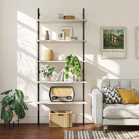 This 5-tier ladder shelf features a wall-mounted design that is perfect for home and office use. The wall-mounted bookshelf provides larger size storage space for your various storage needs. The modern wall-mounted shelf design gives a sense of refinement to many scenes, such as house, office, and cafe, which is a perfect addition. Dimension: 31"L*12"W*70"H Material: CARB P2 Wood + Steel Frame Shelf Bearing: 20LBS for each shelf Note: This ladder shelf needs to be fixed on the wall. Bookshelf With Storage, 5 Tier Bookshelf, Flower Display Stand, Coffee Table Fireplace, Mounted Bookshelf, Pipe Bookshelf, Bathroom Balcony, Wall Ladder, Balcony Office