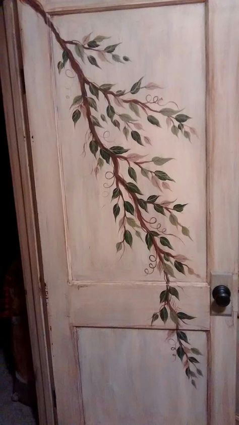 This is a Painted Door for a bedroom.  It was given an antique finish after painting.   A branch with multiple colors of leaves. Cottagecore Door Decor, Aesthetic Bedroom Door Ideas, Paint Bathroom Door Ideas, Vines On Door Bedroom, Door Frame Art, Simple Door Painting Ideas, Door Paint Design Ideas, Wooden Door Painting Ideas, Flowers Painted On Door