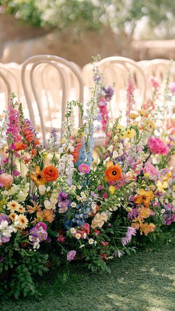 Outdoor Floral Wedding Receptions, Flower Fairy Wedding, Flower Moxie Wildflower, Romantic Spring Wedding Colors, Spring Venue Wedding, Wedding Tables With Food, Chandelier With Flowers Wedding, Wedding Inspo Pink And Green, Asymmetrical Arbor Flowers