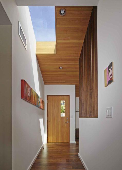 Dwell - A Mid-Century Modern Makeover in Los Angeles Angeles, Los Angeles, Mid Century Modern Interior Doors, Mid Century Modern Hallway, Modern Skylights, Mid Century Modern Makeover, Wood Hallway, Mid Century Modern Door, Mid Century Modern Entryway