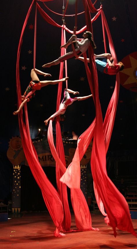 Circus Silks Aesthetic, Dnd Circus Performer, Red Circus Aesthetic, Circus Aesthetic Acrobat, Juggling Aesthetic, Aerial Dance Aesthetic, Traveling Circus Aesthetic, Ringleader Aesthetic, Magic Show Aesthetic