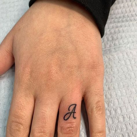 A Tattoo Letter Initial On Finger, J On Ring Finger Tattoo, Small Initial Tattoo Ideas Letters Finger, H Finger Tattoo, Letter A Finger Tattoo, Tattoo Of Letter A, Tattoo Initials Finger, J Initial Tattoo Finger, Letters On Fingers Tattoo