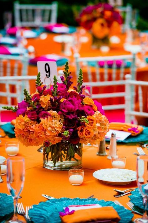 Mexican Decor Centerpieces, Colourful Wedding Table Centerpieces, Pink And Orange Floral Centerpieces, Indian Centerpieces Wedding, Indian Wedding Table Decorations Centerpiece Ideas, Orange And Purple Party Decorations, Mexican Bridal Bouquet, Emerald Pink Orange Wedding, Purple Blue Orange Wedding