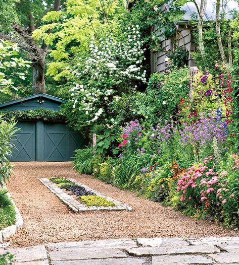 Add flowerbeds or planting to soften the look of your driveway. More curb appeal on a dime: http://www.bhg.com/home-improvement/exteriors/curb-appeal/curb-appeal-on-a-dime/?socsrc=bhgpin081613driveway=14 Narrow Driveway Ideas, Small Parking Area Ideas, Cottage Driveway, Rustic Garage, Detached Garage Designs, Gravel Parking, Garden Driveway, Curb Appeal Landscape, Driveway Ideas