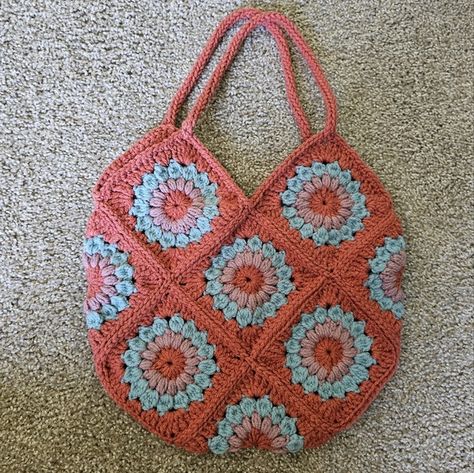 Shop magnolia_posh's closet or find the perfect look from millions of stylists. Fast shipping and buyer protection. New, handcrafted crochet flower tote made in a smoke-free, pet-free home. 100% acrylic. Measures 13"×13" Pretty Granny Squares, Crochet Bag Charm, Beach Bag Gift, Fall Tote Bag, Wool Tote, Bags Crochet, Granny Square Crochet Patterns, Flower Tote, Reversible Tote Bag