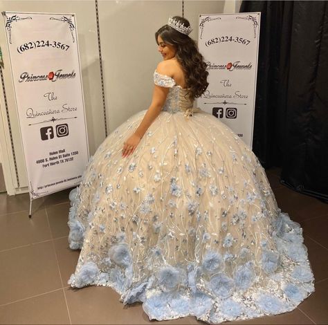 White Quince Dress With Blue Flowers, Rare Quince Dresses, White Flower Quince Dresses, White And Blue Quince Dress, Cream White Quinceanera Dresses, Light Blue And Gold Quinceanera Dress, White Sweet Sixteen Dresses, Quince Dress White And Gold, Quinceanera Dresses Cream
