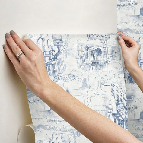 "Find this RoomMates Blue Harry Potter Map Peel & Stick Wallpaper at Michaels. com. This graceful map pattern creates a surreal look with minimal effort. Modern yet timeless, create an Hogwarts-worthy room in minutes with our peel and stick technology. Mystical and magical, Harry Potter Map Peel and Stick Wallpaper is sure to catch the eye of everyone who enters your home. This graceful map pattern creates a surreal look with minimal effort. Modern yet timeless, create an Hogwarts-worthy room in Harry Potter Shelf Display, Harry Potter Bedroom Aesthetic, Harry Potter Inspired Bedroom, Hogwarts Map, Harry Potter Map, Harry Potter Bookshelf, Ravenclaw Room, Pottery Barn Harry Potter, Harry Potter Office