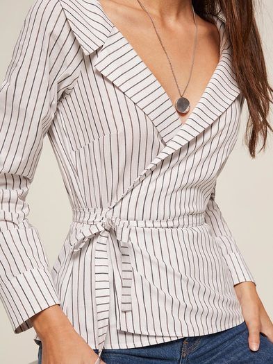 Tied up. This is a long sleeve, wrap top with notched lapels and a side waist tie.http://bit.ly/2pdOJ0o Tie Up Top, Wrap Tops, Kleidung Diy, Fashion Tops Blouse, Trendy Fashion Tops, Wrap Shirt, Fashion Hacks Clothes, Designs For Dresses, Wrap Top