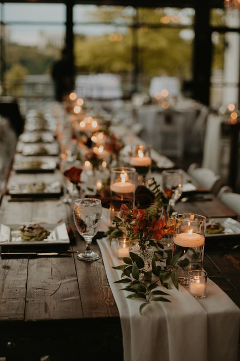 Wedding Table Decor with Cheesecloth Runner and Greenery Arrangements with Floating Candle Centerpieces Rustic Wedding Candles, Harvest Table Decor Wedding, Picnic Table Decor Wedding, Rustic Long Table Wedding, Wedding Farmhouse Decor, Wedding Table Decorations For Long Tables, Wedding Homemade Decorations, Candle Runner Centerpiece, Wedding Table Decor Candles Only