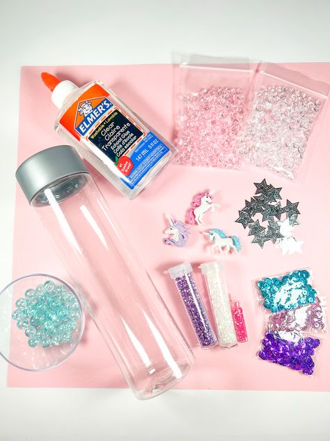 Easy DIY Unicorn Sensory Bottle - In The Playroom Diy Calming Bottle, Calming Bottles Diy, Unicorn Birthday Activities Kids, Diy Sensory Bottles, Birthday Activities Kids, Voss Water Bottle, Calming Bottle, June Activities, Calm Down Jar