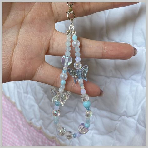 Get the perfect ring to complete your outfit on Amazon. Blue Phone Strap Beads, Beads Charm Phone, How To Make A Keychain For Your Phone, Blue Phone Charm Ideas, Phone Keychain Aesthetic, Phone Keychain Beads Aesthetic, Cute Keychain For Backpacks, Phone Charm Keychain, Phone Charms Aesthetic Blue