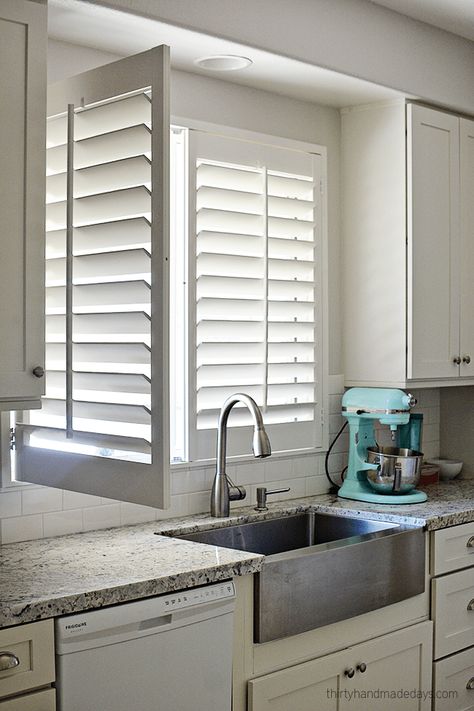 Shutters on window over kitchen sink with one panel open Kitchen Window Shutters, Kitchen Window Treatments Ideas, Window Shutters Indoor, Shutters Indoor, Kitchen Shutters, Kitchen Window Coverings, Window Treatments Ideas, White Shutters, Interior Window Shutters