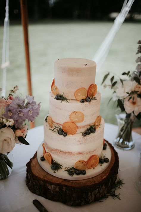 Semi-Naked Wedding Cake on Rustic Stand With Orange Slice Decor Pastel, Wedding Cake On Wood Slice, Wedding Cakes Homemade, Cake With Orange Decoration, Wedding Cake With Orange Slices, Wedding Cake With Oranges, Orange Slice Wedding Cake, Dried Orange Wedding Cake, Simple Homemade Wedding Cake