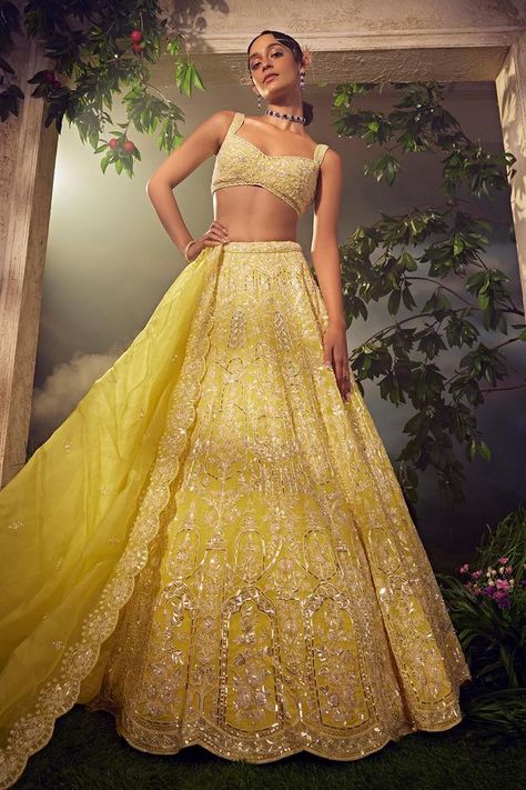 Prime yellow attached cancan organza lehenga, fully hand embroidered with various ornamental sequins and Japanese bugle beads in floral pattern. Comes with a scallop dupatta and embroidered padded blouse. Components: 3 Pattern: Hand Embroidered Type Of Work: Sequins, Beads, Neckline: Sweetheart Sleeve Type: Sleeveless Fabric: Net Color: Yellow Other Details:  Scalloped hem dupatta Scoop back blouse Length: Lehenga: 45 inches Blouse: 14 inches Dupatta: 3 mtrs Occasion: Bride,Wedding - Aza Fashion Ellora, Yellow Indian Wedding Dress, Yellow Organza Lehenga, Yellow Lengha, Lehenga Yellow, Scallop Dupatta, Simple Lehenga, Organza Lehenga, Yellow Lehenga
