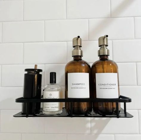 This seemingly simple upgrade can make all the difference in your shower! Rather than a collection of half-used bottles in any random color, shape, or size, fill up matching containers to keep in your shower, then keep the refills under the sink and out of sight. This visual clutter reduction really elevates your bathroom experience! Minimalist Shower Caddy, Shower Caddy Decor, Shower Caddy Aesthetic, Shower Caddy Ideas, Shower Organization Ideas, Black Shower Caddy, Hotel Style Bathroom, Bathroom Labels, Aesthetic Shower