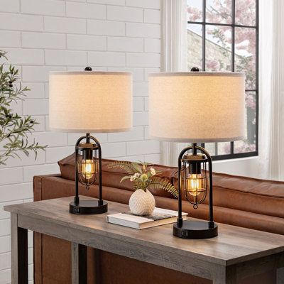 Combining industrial- era detailing and soft modern style this lamp set is a superb choice for your living space. LED bulbs included for both light, provides different lighting solution. Built-in 5V 2.1A USB ports included. | Longshore Tides 21.5” Table Lamp Set w / Night Light & Usb Port Metal / Fabric in Brown / Red / White, Size 21.5 H x 12.0 W x 12.0 D in | Wayfair Modern Nightstand Lamps, Bedroom Lamps Nightstand, Dimmable Table Lamp, Farmhouse Table Lamps, Black Bedside Table, Table Lamp Set, Bronze Table Lamp, Lantern Design, Tripod Table Lamp