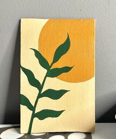 Acrylic painting of a plant in front of a sun. Warm tones and minimalist vibes.