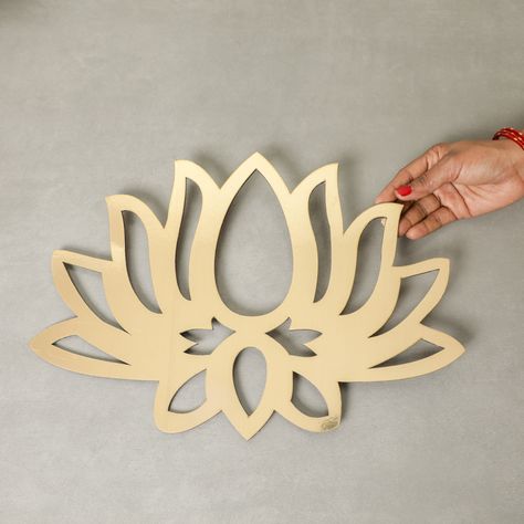 Known for spirituality and also Lord Brahma's vehicle of choice, the lotus flower is not only beautiful but also embodies spirituality. Celebrate your Indian roots and embrace the Indian culture anywhere in the world with this lotus flower cutout by Desi Favors. * Golden laser cut lotus flower, 16 inches wide and 12 inches in height * Looks beautiful on the walls, doors or other surfaces * These are so versatile you can stick any color paper on the back of the cutout to change the color of the L Lotus Cutout, Indian Backdrop, Reception Background, Varalakshmi Pooja, Pooja Decor, Flower Cutout, Indian Culture, Color Paper, Decorations Wedding