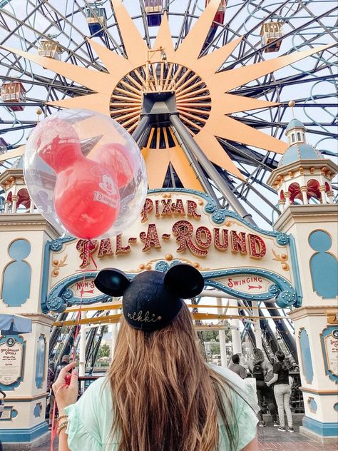 A girl stands with a Mickey ballon, Mickey ears, with her back turned away from the camera. She stands in front of the entrance to Pixar pier, which has the words “Pixar Pal-A-Round” Disneyland California Adventure Aesthetic, California Disneyland Photography, Disneyland California Adventure Pictures, Disney California Adventure Poses, Disneyland Pictures Ideas, Disneyland Photo Ideas Instagram, Cute Disneyland Pictures, Disneyland California Photo Ideas, Aesthetic Disneyland Pictures