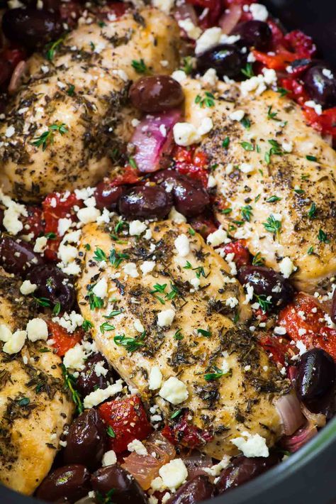 Slow Cooker Greek Chicken – moist, juicy chicken with a bright Mediterranean flavors, roasted red peppers, and feta. Easy, healthy, and absolutely delicious crockpot recipe! Recipe at wellplated.com #crockpot #slowcooker #chicken #healthyrecipe Greek Chicken Breast Recipes, Slow Cooker Greek Chicken, Greek Chicken Breast, Delicious Crockpot Recipes, Fall Crockpot Recipes, Mediterranean Flavors, Chicken Crockpot Recipes Healthy, Crockpot Chicken Healthy, Greek Chicken Recipes