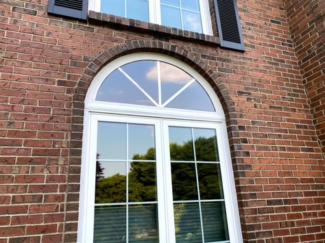 Removing half-moon pediment above window. Need ideas for new look! Updating Arched Windows, Rounded Windows Exterior, Exterior Oval Window, Half Round Windows Ideas Exterior, How To Update Arched Windows, Half Circle Window Covering Ideas, Half Round Windows Ideas, Arched Transom Over Front Door, Semi Circle Window