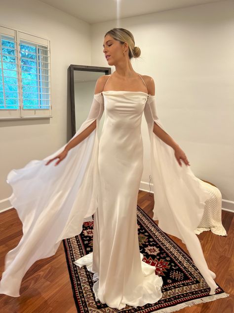 Wedding Dress With Fairy Wings, 2012 Wedding Dresses, Wedding Dresses With Bat Wing Sleeves, Open Sleeve Wedding Dress, Flowy White Dress Long, Silk Cowl Back Wedding Dress, Angel Wing Wedding Dress, Ethereal Wedding Dress Long Sleeve, Liquid Wedding Dress