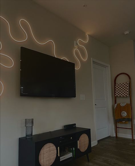 Rope Led Lights Ideas, Lights Around Tv On Wall, Lighting For Apartments Living Rooms, Led Light Tv Wall, Curvy Led Light On Wall, Flexible Led Strip Lights Ideas, Light Rope Ideas, Neon Rope Light Bedroom, Led Sign Living Room