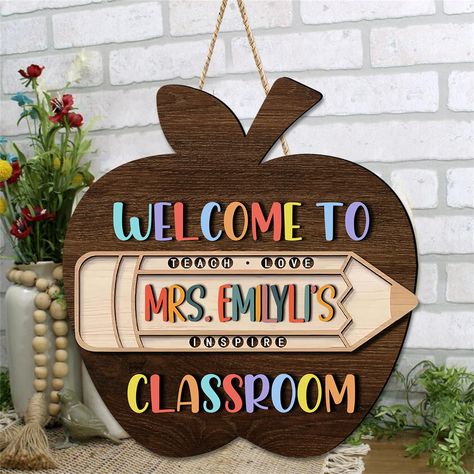 PRICES MAY VARY. Persoanlized Teacher Sign for Classroom▶ Personalized Welcome Sign for Classroom is with back-to-school elements such as apples, books, pencils, and "Welcome to Classroom" printed on it. You can upload the teacher's name (please specify if you want Mrs. or Mr.). Personalized classroom welcome door hangers designed for teachers. Welcome Back to School Door Sign▶ Our teachers' plaques look beautiful and vibrant, easily attracting the children's attention when they return to school Classroom Door Signs Teacher Name, Teacher Diy Classroom Decor, Teacher Signs For Classroom, Welcome Back To School Sign, Signs For Classroom, Welcome To Classroom, Welcome To Our Classroom, Teacher Welcome Signs, School Elements