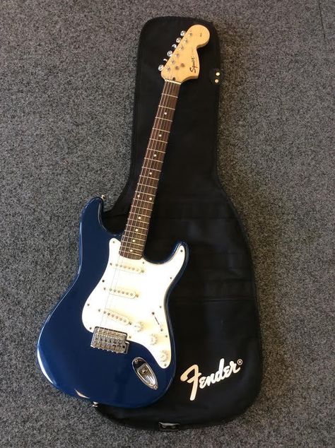 Fender Squier Strat Affinity Series Electric Guitar Dark Blue. My second guitar.💙 Dark Blue Guitar Aesthetic, Strat Electric Guitar, Guitar Bag Aesthetic, Navy Blue Electric Guitar, Blue Aesthetic Guitar, Cool Guitars Electric, Blue Electric Guitar Aesthetic, Blue Guitar Aesthetic, Cute Electric Guitar