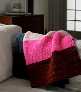 Super Easy Lap Blanket - Curl up with this Super Easy Lap Blanket. Knit with the garter stitch, this colorful afghan pattern is perfect for anyone who wants to learn how to knit a blanket that is sure to keep them nice and toasty during the winter months. This is one of the best beginner knitting projects for those who are looking for something they can work on all throughout the snowy season. Couture, Sock Yarn Shawls, Knitting Gloves, Yarn Shawl, Purl Bee, Easy Baby Blanket, Patchwork Baby, Purl Soho, Manta Crochet