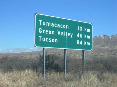 The signs were changed to reflect metric distances and have managed to stay that way even decades after the act was abolished in 1982.  In fact, local businesses and residents have prevented changes to the signs, noting the unique identity it gives this small section of Arizona. Interstate Highway, Mexican Border, Chicago Neighborhoods, Exit Sign, Driving License, Wayfinding Signage, Green Valley, Land Of The Free, Road Trippin