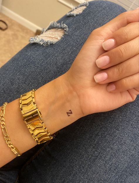 A Wrist Tattoo, Unique Small Tattoos Wrist, Small Letter Wrist Tattoo, Small Tattoo Placement Wrist, Small One Letter Tattoo, Dainty Tattoos On Wrist, H Wrist Tattoo, Tiny Letter Tattoo Wrist, Small 5 Tattoo