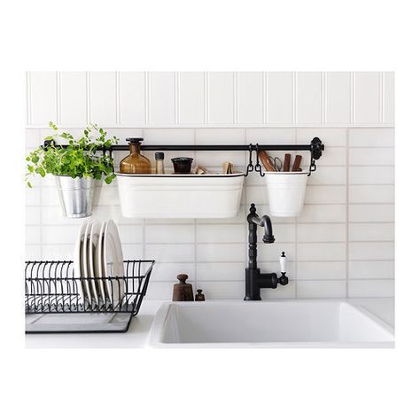 Make the most of a tiny counter with a wall-mounted sink caddy. | 17 Ways To Squeeze A Little Extra Storage Out Of A Tiny Kitchen Fintorp Ikea, Above The Kitchen Sink, Organiser Cucina, Små Rum Lidt Plads, Koti Diy, Clutter Free Kitchen, Apartment Needs, Small Apartment Kitchen, Small Kitchen Storage