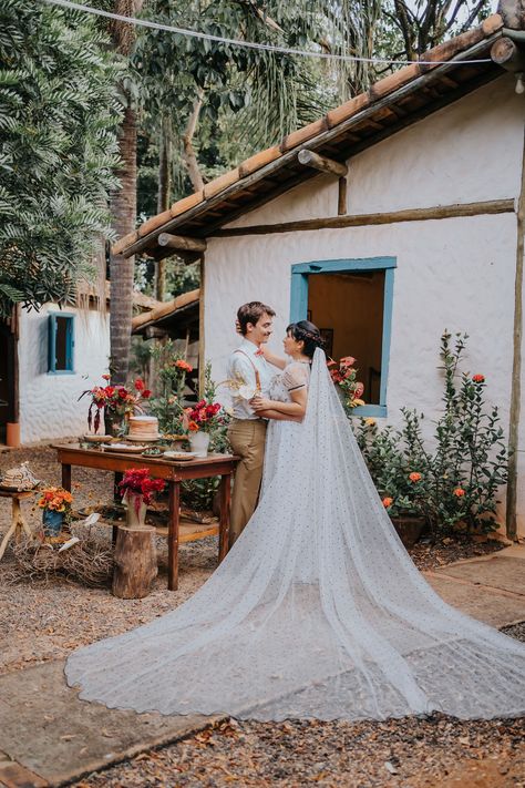 Brazil is home to breathtaking views, delicious food, and possibly, inspiration for your wedding! This enchanting editorial designed by Styling de Eventos was inspired by the traditions of Brazil’s sertão region – an area to the Northeast of the country known for its lively and rich culture. Polka Dot Veil, Enchanting Wedding, Embroidered Gown, Romantic Look, Groom Attire, Floral Display, Groom Style, Editorial Design, Breathtaking Views