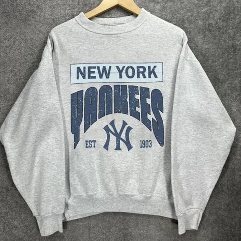 Vintage New York EST 1903 Baseball Sweashirt, New York Baseball Crewneck, The Yankee Shirt, New York Baseball Hoodie,  Baseball Fan Gifts 🍰   The unisex heavy cotton tee is the basic staple of any wardrobe. It is the foundation upon which casual fashion grows. A range of t-shirts featuring a huge variety of original designs in sizes XS-5XL; availability depending on style. T-shirt colors are available in the best-selling black, the classic white, and many others. 🍰   About us   WE USE GILDAN BRAND FOR OUR PRODUCTS: - Unisex T-Shirt Brand Gildan 5000 - Unisex Crewneck Sweatshirt Brand Gildan 18000 - Unisex Hooded Sweatshirt Brand Gildan 18500 - Unisex Long Sleeve T-Shirt Brand Gildan 24000 - Ladies' V-Neck T-Shirt Brand Gildan 5V00L 💎   HOW TO ORDER: - Select the 𝗦𝗶𝘇𝗲 - Select the sh Vintage New York, Ny Baseball, College Sweater, Brown Crewneck, Yankees T Shirt, Baseball Hoodie, Future Outfit, Gildan Sweatshirts, Baseball Fan