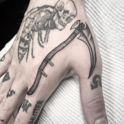 Scythe Hand Tattoo, Small Scythe Tattoo, Scythe Tattoo Traditional, Grim Reaper Scythe Tattoo, Hand Thumb Tattoo, Hands Tattoo Men, Thumb Hand Tattoo, Reaper Scythe Tattoo, Subtle Hand Tattoos