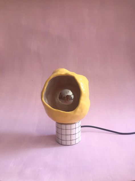 *  Brighten your space with our Ceramic Table Lamp - a beautiful marriage of organic and geometric forms. This sculptural small bedside lamp, crafted in a vibrant yellow, adds a playful pop of color and a minimalist aesthetic to any room. Its subtle lighting creates a warm, inviting ambiance, making it an ideal choice for any home decor. Durable, functional, and stylish, it serves as a great house decor gift. Illuminate your home with this perfect blend of art and light today *  Ceramic lighting Cermaic Lamps, Small Ceramic Ideas, Abstract Ceramics, Lighting House, Small Bedside Lamps, Organic Lighting, Ceramic Lighting, Lamp Yellow, Ceramic Lamps