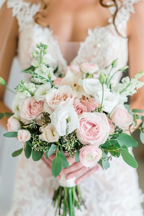 Celebrate the season with spring wedding bouquets filled with soft pastels and vibrant blooms. See more ideas here.