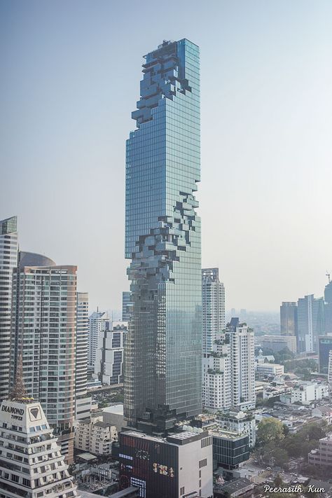 If you're waiting for these pictures of Bangkok's new tallest skyscraper to finish downloading, don't worry, they already have. Because although it looks like it's missing a pixel or two, we promise you that it's supposed to look like this. Baroque Architecture, Futuristic Architecture, Architecture Cool, Architecture Unique, Unusual Buildings, Modern Architecture Building, Skyscraper Architecture, Amazing Buildings, Unique Architecture